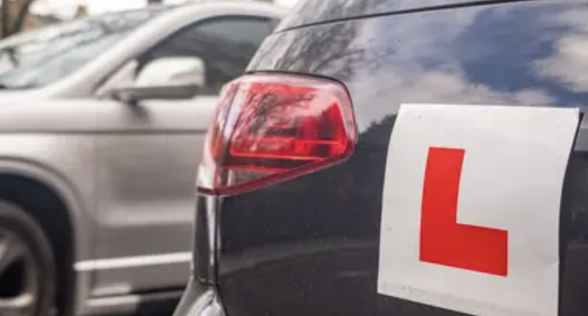 Learner driver L plate on car during the wait for a driving test